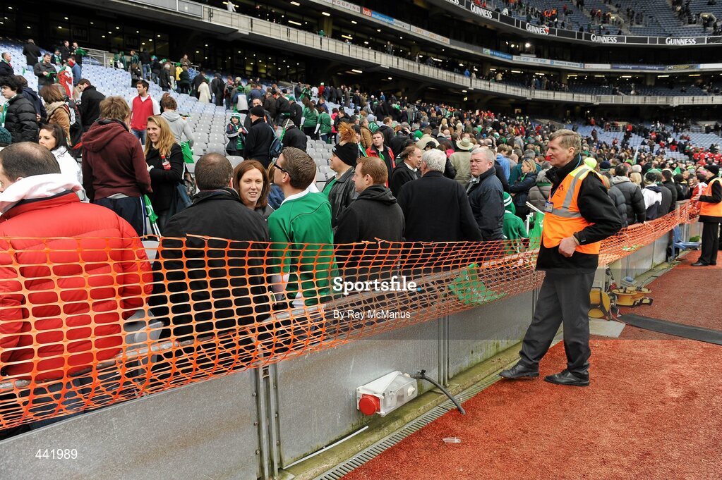 13 March 2010; Supporters are kept off the pitch at the end of the game by stewards and wire mesh. RBS Six Nations Rugby Championship, Ireland v Wales, Croke Park, Dublin. Picture credit: Ray McManus / SPORTSFILE