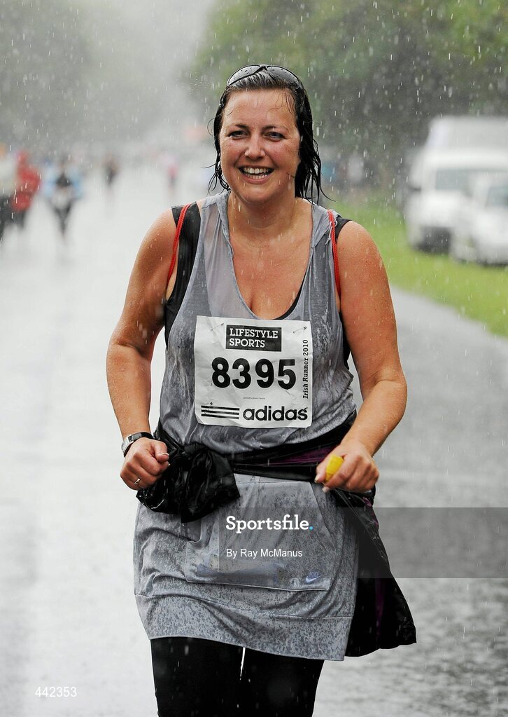 17 July 2010; Kelli Dawson, from Kildare Town, finishes the race in pouring rain during the Lifestyle Sports - adidas Irish Runner 5 Mile Race. The Phoenix Park, Dublin. Picture credit: Ray McManus / SPORTSFILE