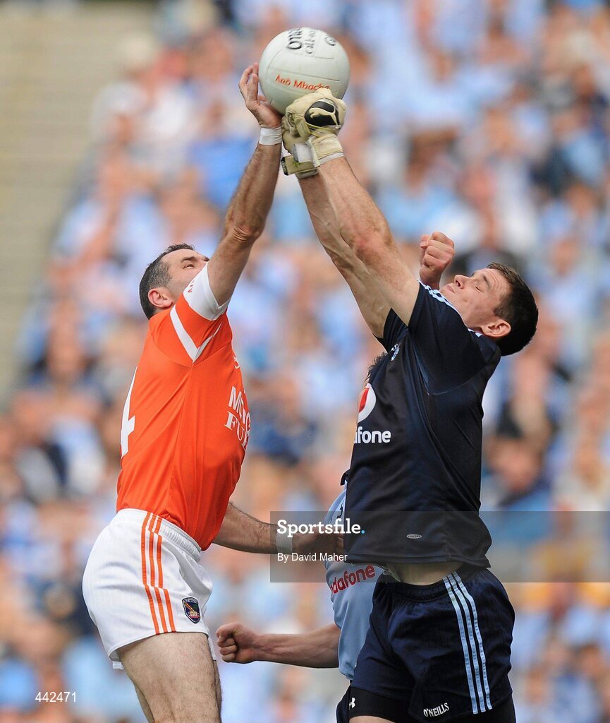 17 July 2010; Steven McDonnell, Armagh, scores a point under pressure from Stephen Cluxton, Dublin. GAA Football All-Ireland Senior Championship Qualifier Round 3, Dublin v Armagh, Croke Park, Dublin. Picture credit: David Maher / SPORTSFILE