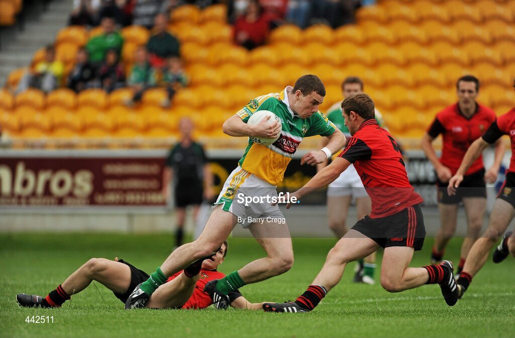 17 July 2010; Niall McNamee, Offaly, in action against Damian Rafferty, left and Darren O' Hagan, Down. GAA Football All-Ireland Senior Championship Qualifier Round 3, Down v Offaly, O'Connor Park, Tullamore, Co. Offaly. Picture credit: Barry Cregg / SPORTSFILE