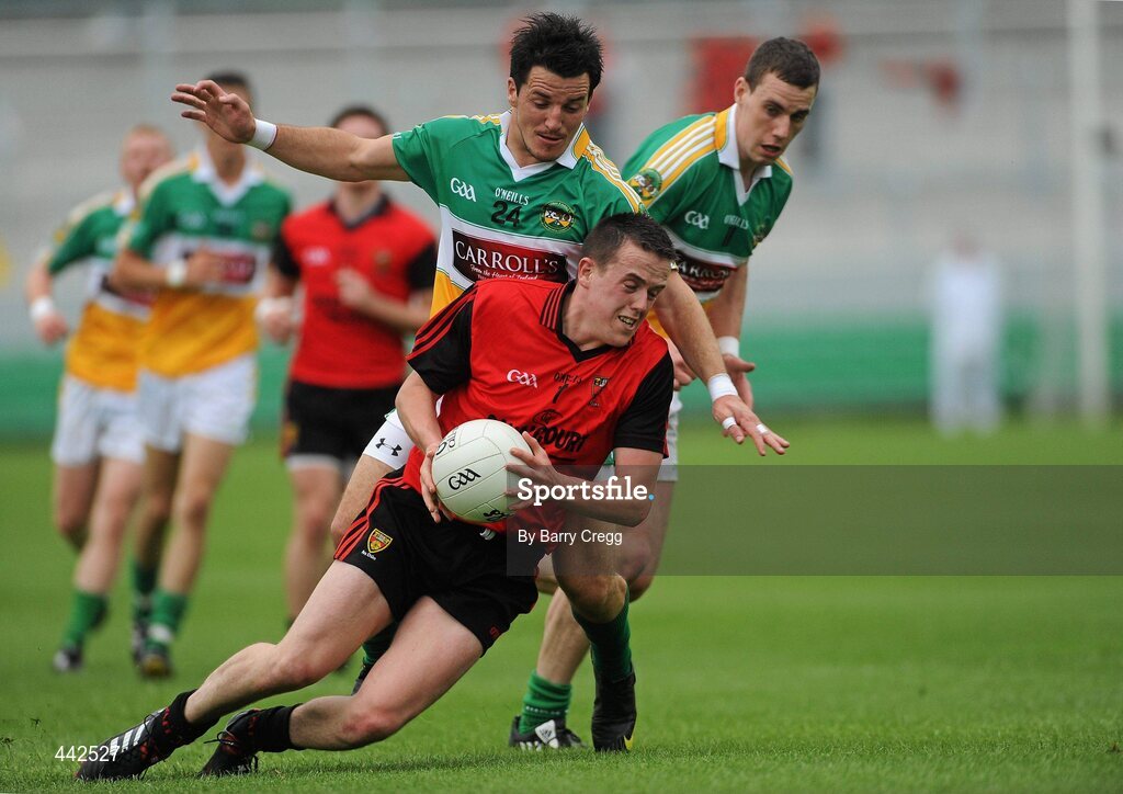 17 July 2010; Conor Garvey, Down, is fouled by John Reynolds, Offaly. GAA Football All-Ireland Senior Championship Qualifier Round 3, Down v Offaly, O'Connor Park, Tullamore, Co. Offaly. Picture credit: Barry Cregg / SPORTSFILE