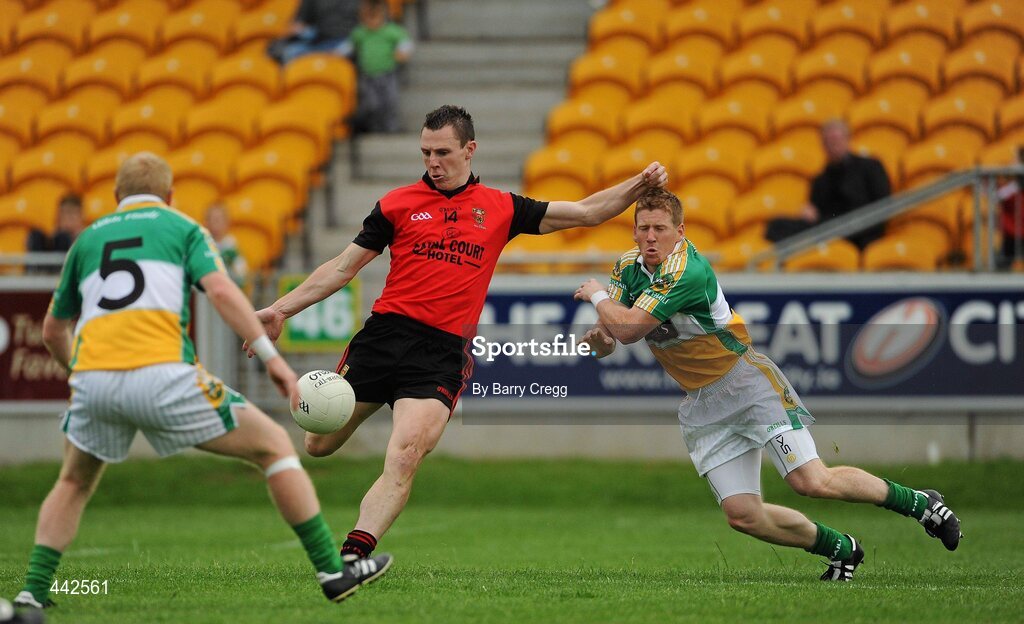 17 July 2010; John Clarke, Down, in action against Brian Darby, right and Niall Darby, Offaly. GAA Football All-Ireland Senior Championship Qualifier Round 3, Down v Offaly, O'Connor Park, Tullamore, Co. Offaly. Picture credit: Barry Cregg / SPORTSFILE