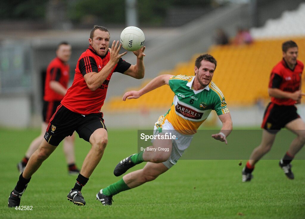 17 July 2010; Ambrose Rogers, Down, in action against Ross Brady, Offaly. GAA Football All-Ireland Senior Championship Qualifier Round 3, Down v Offaly, O'Connor Park, Tullamore, Co. Offaly. Picture credit: Barry Cregg / SPORTSFILE