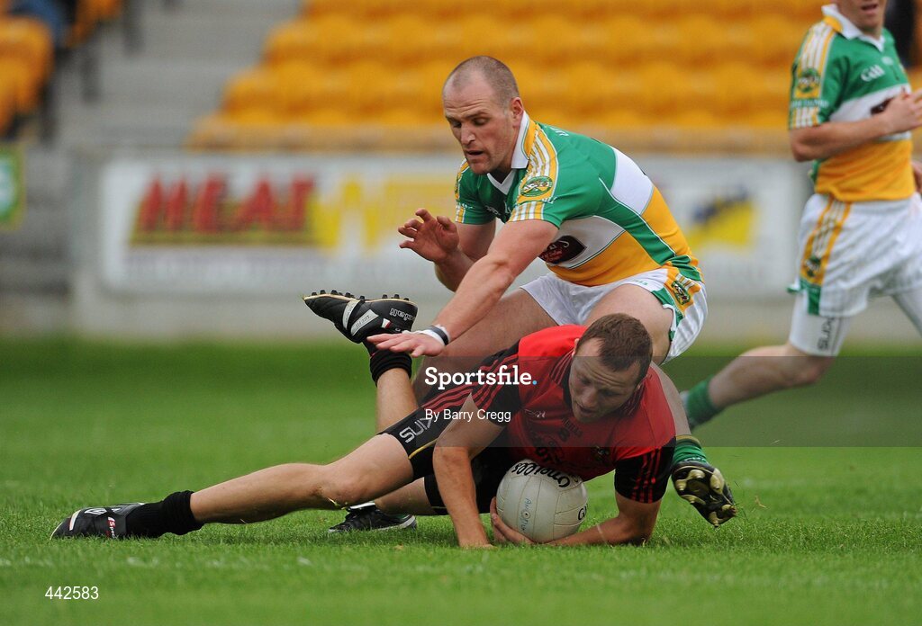 17 July 2010; Ambrose Rogers, Down, is fouled by Scott Brady, Offaly. GAA Football All-Ireland Senior Championship Qualifier Round 3, Down v Offaly, O'Connor Park, Tullamore, Co. Offaly. Picture credit: Barry Cregg / SPORTSFILE