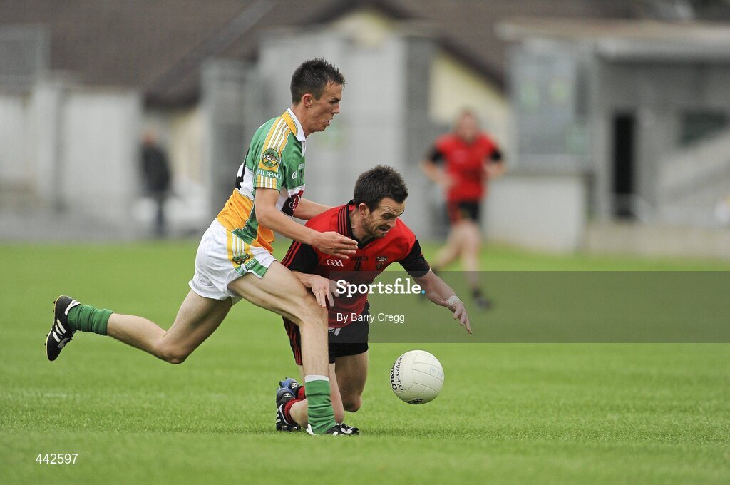 17 July 2010; Mark Poland, Down, is fouled by Graham Guilfoyle, Offaly. GAA Football All-Ireland Senior Championship Qualifier Round 3, Down v Offaly, O'Connor Park, Tullamore, Co. Offaly. Picture credit: Barry Cregg / SPORTSFILE