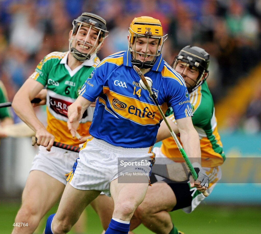 18 July 2010; Lar Corbett, Tipperary, in action against Rory Hanniffy and Paul Cleary, Offaly. GAA Hurling All-Ireland Senior Championship Phase 3, Tipperary v Offaly, O'Moore Park, Portlaoise, Co. Laois. Picture credit: Ray McManus / SPORTSFILE