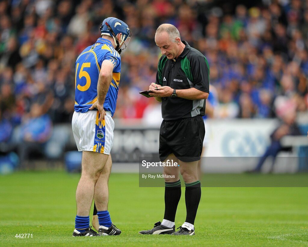 18 July 2010; Eoin Kelly, Tipperary, is booked by referee John Sexton. GAA Hurling All-Ireland Senior Championship Phase 3, Tipperary v Offaly, O'Moore Park, Portlaoise, Co. Laois. Picture credit: Ray McManus / SPORTSFILE