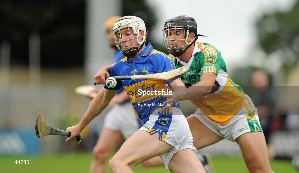 18 July 2010; Michael Cahill, Tipperary, in action against Daniel Currams, Offaly. GAA Hurling All-Ireland Senior Championship Phase 3, Tipperary v Offaly, O'Moore Park, Portlaoise, Co. Laois. Picture credit: Ray McManus / SPORTSFILE