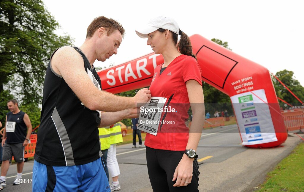 17 July 2010; Louise Rafferty, a member of the adidas 'virgin' running team, from Carrickmacross, Co. Monaghan, has her race number pinned on by her husband Mark Hogg at the Lifestyle Sports - adidas Irish Runner 5 Mile Race. The Phoenix Park, Dublin. Picture credit: Brendan Moran / SPORTSFILE