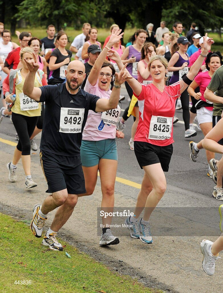 17 July 2010; Photographer Julien Behal, 9492, from Co. Kerry with his fiancee Noeleen McHenry, 9493, from Co. Antrim and Karen Killoran, 8425, from Dublin, during the Lifestyle Sports - adidas Irish Runner 5 Mile Race. The Phoenix Park, Dublin. Picture credit: Brendan Moran / SPORTSFILE