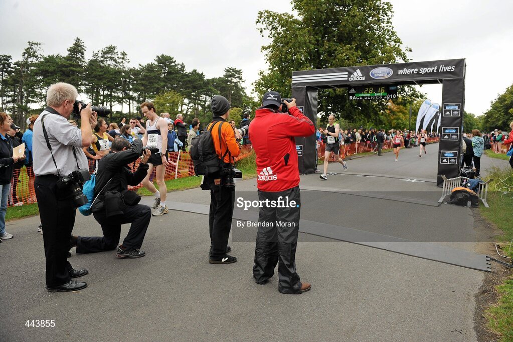 17 July 2010; Photographers record some of the finishers during the Lifestyle Sports - adidas Irish Runner 5 Mile Race. The Phoenix Park, Dublin. Picture credit: Brendan Moran / SPORTSFILE