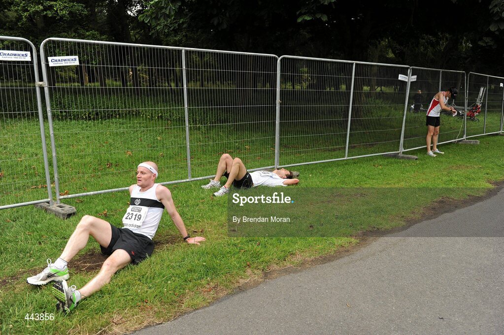 17 July 2010; George Brady, from Dublin, left, and other competitors take a breather after finishing the Lifestyle Sports - adidas Irish Runner 5 Mile Race. The Phoenix Park, Dublin. Picture credit: Brendan Moran / SPORTSFILE
