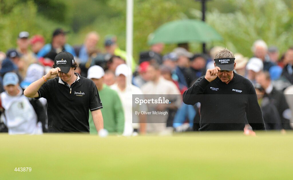 21 July 2010; Rory McIlroy, left, and Darren Clarke, tip their hats to the crowd coming on to the fifth green during the 2010 Lough Erne Challenge. Lough Erne Resort, Enniskillen, Co. Fermanagh. Picture credit: Oliver McVeigh / SPORTSFILE