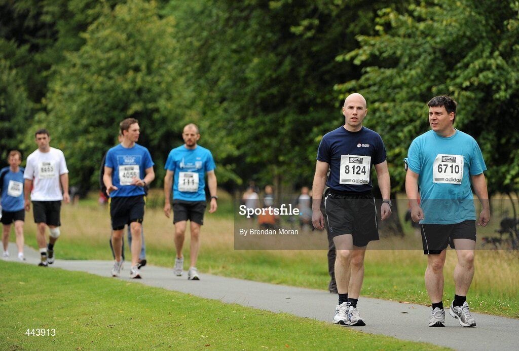 17 July 2010; Competitors James Doyle, 8124, and David Dunne, 6710, both from Dublin, make their way to the start ahead of the Lifestyle Sports - adidas Irish Runner 5 Mile Race. The Phoenix Park, Dublin. Picture credit: Brendan Moran / SPORTSFILE