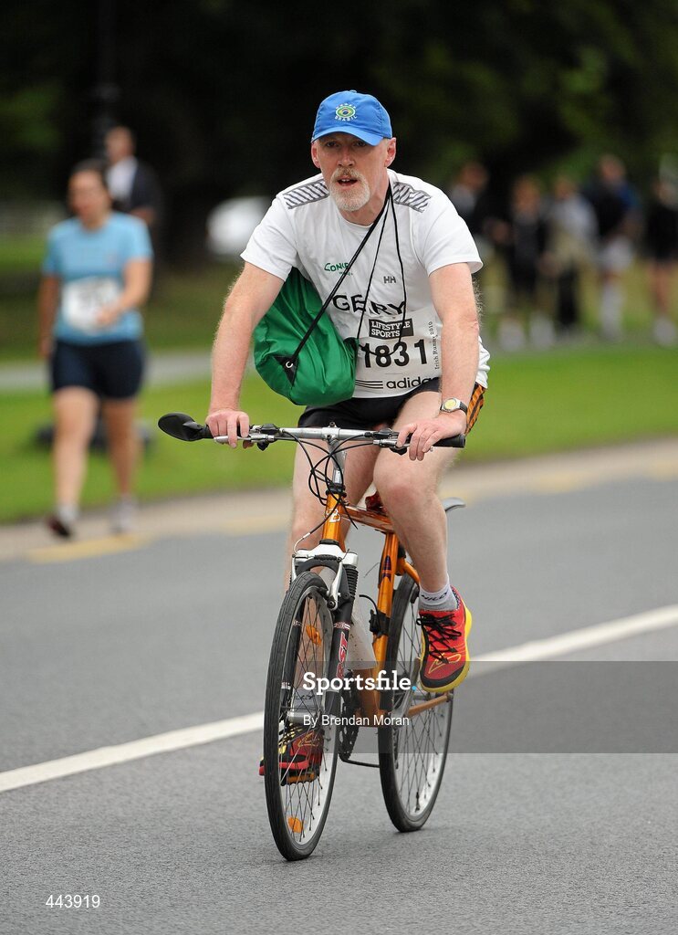 17 July 2010; Competitor Gerry Meaney, from Sligo, makes his way to the start on a bicycle ahead of the Lifestyle Sports - adidas Irish Runner 5 Mile Race. The Phoenix Park, Dublin. Picture credit: Brendan Moran / SPORTSFILE