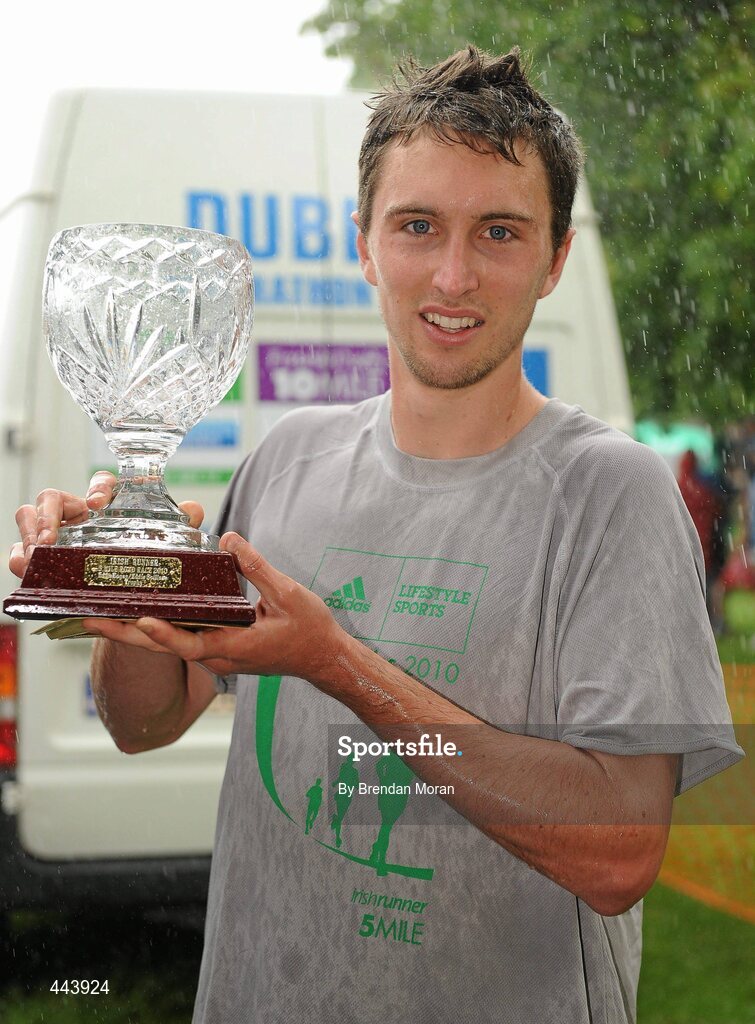 17 July 2010; Men's race winner John Coghlan, Metro St brigid's AC, with his trophy after the Lifestyle Sports - adidas Irish Runner 5 Mile Race. The Phoenix Park, Dublin. Picture credit: Brendan Moran / SPORTSFILE