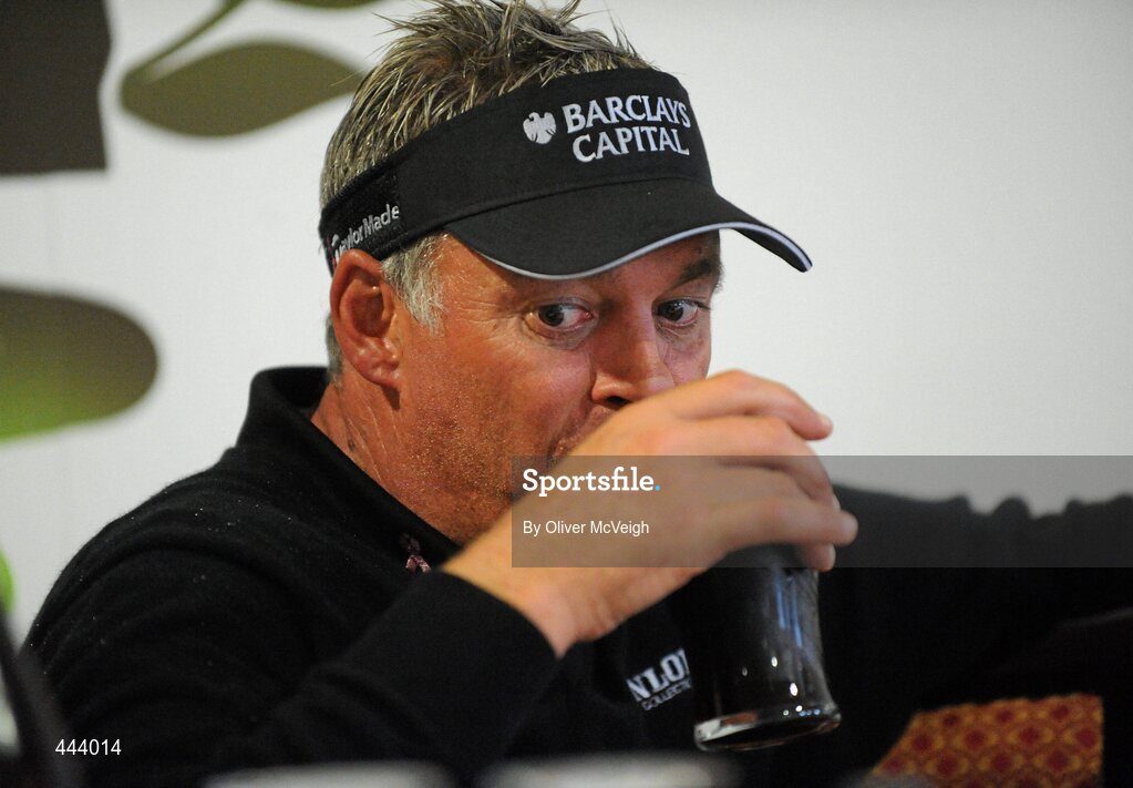 21 July 2010; Golfer Darren Clarke enjoys a pint during a press conference after the 2010 Lough Erne Challenge. Lough Erne Resort, Enniskillen, Co. Fermanagh. Picture credit: Oliver McVeigh / SPORTSFILE