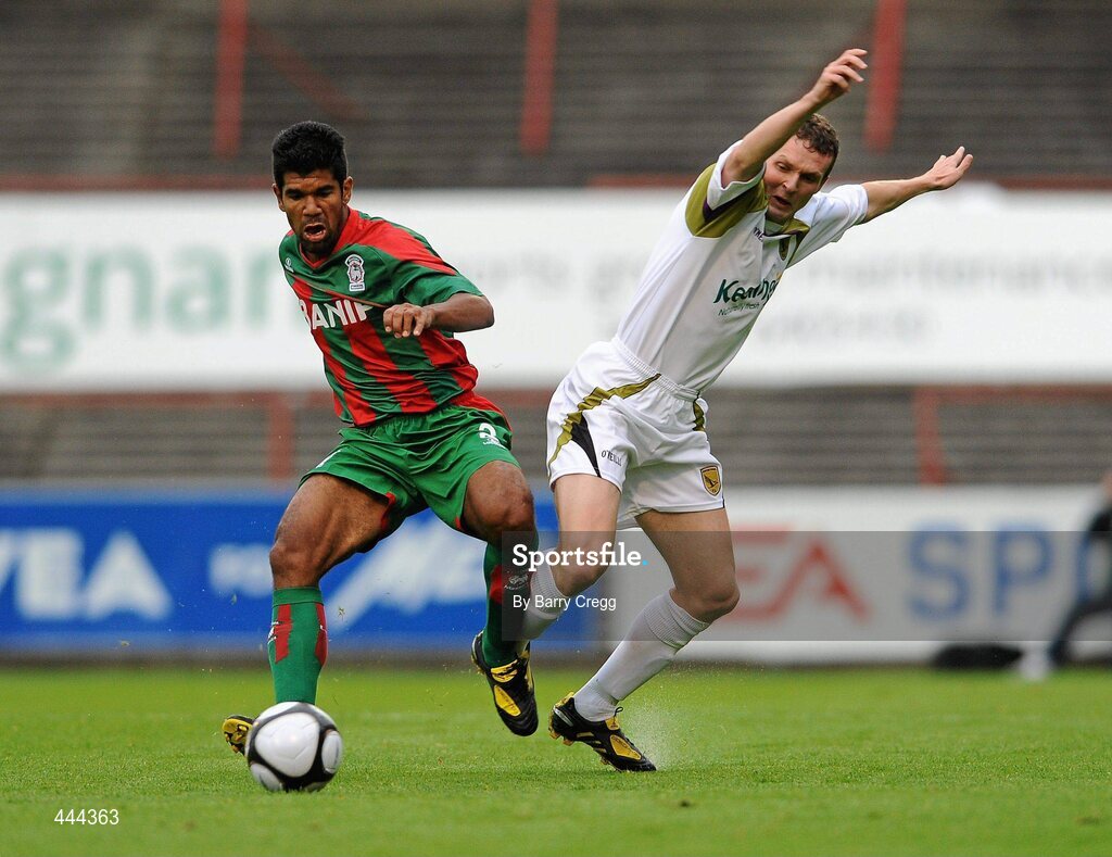 22 July 2010; Alonso Ferreira de Matos, CS Marítimo, fouls Conan Byrne, Sporting Fingal. UEFA Europa League Second Qualifying Round, 2nd Leg, Sporting Fingal v CS Marítimo, Dalymount Park, Dublin. Picture credit: Barry Cregg / SPORTSFILE