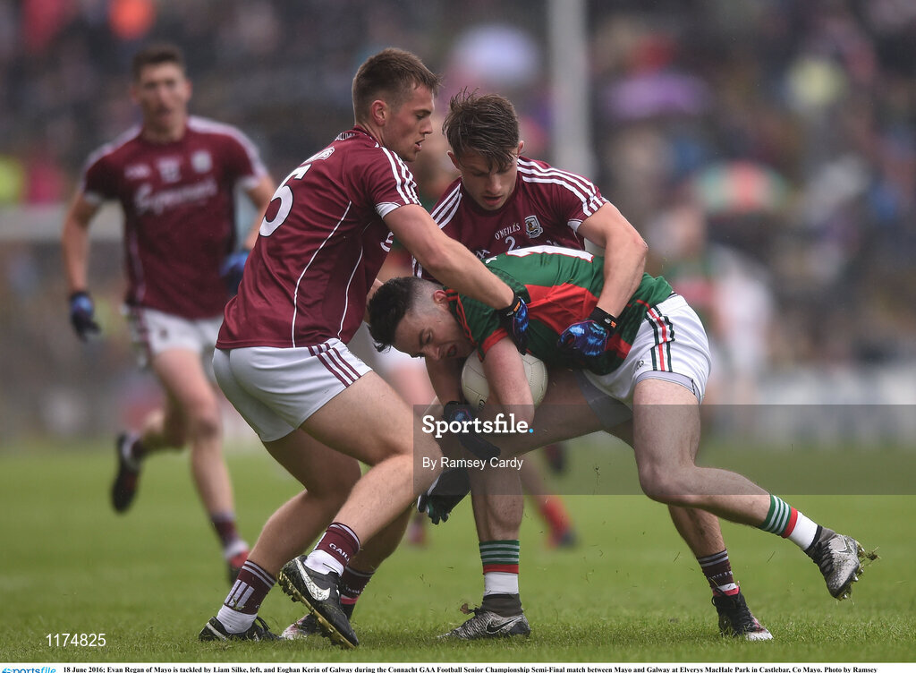 18 June 2016; Evan Regan of Mayo is tackled by Liam Silke, left, and Eoghan Kerin of Galway during the Connacht GAA Football Senior Championship Semi-Final match between Mayo and Galway at Elverys MacHale Park in Castlebar, Co Mayo. Photo by Ramsey Cardy/Sportsfile