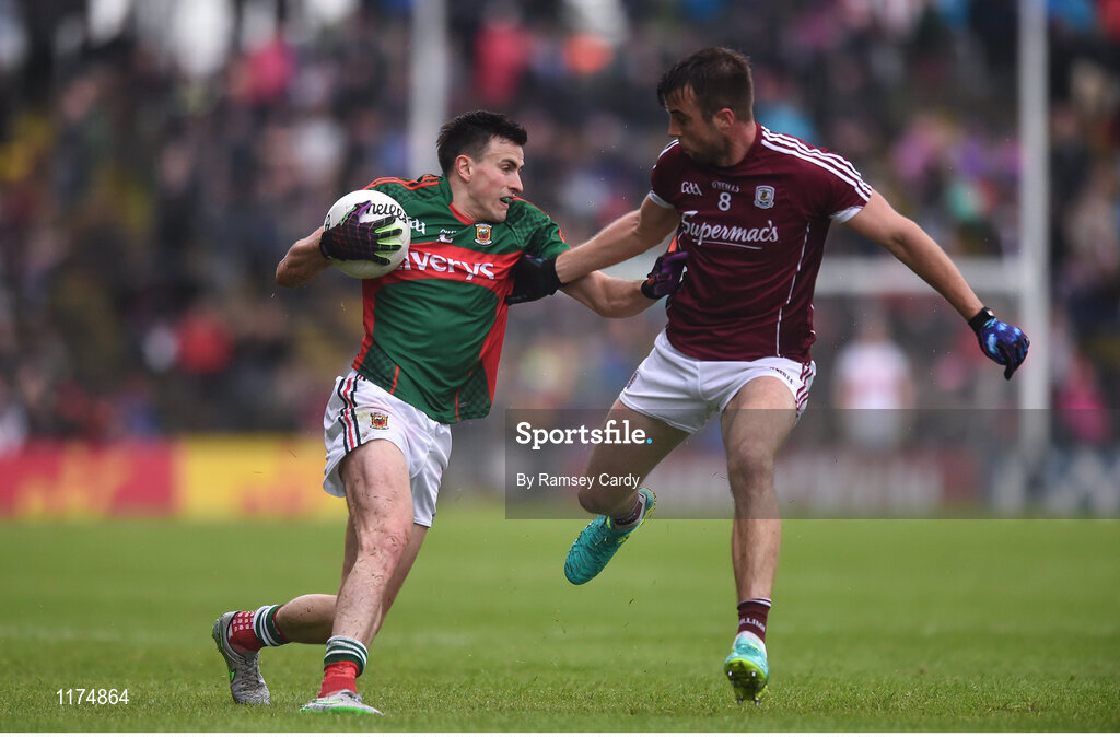 18 June 2016; Jason Doherty of Mayo is tackled by Paul Conroy of Galway during the Connacht GAA Football Senior Championship Semi-Final match between Mayo and Galway at Elverys MacHale Park in Castlebar, Co Mayo. Photo by Ramsey Cardy/Sportsfile