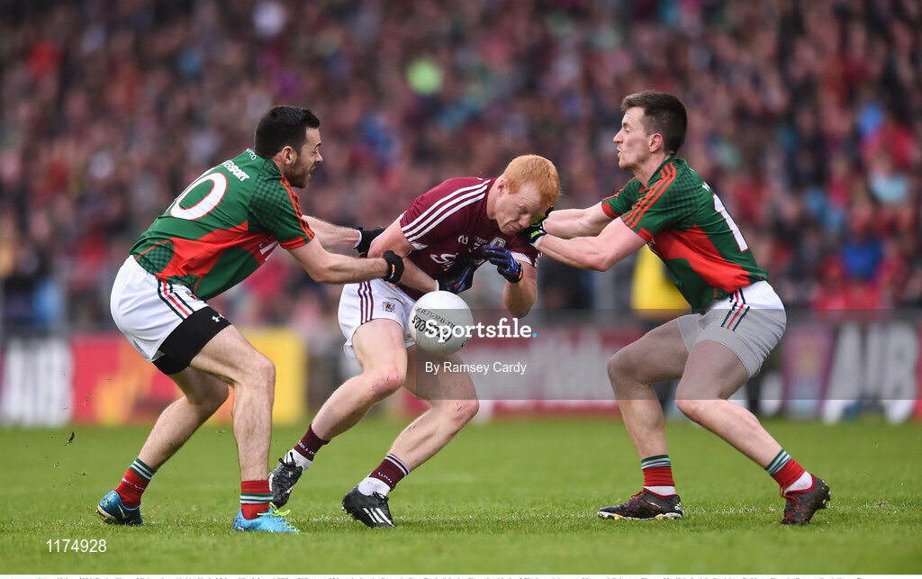 18 June 2016; Declan Kyne of Galway is tackled by Kevin McLoughlin, left, and Cillian O’Connor of Mayo during the Connacht GAA Football Senior Championship Semi-Final match between Mayo and Galway at Elverys MacHale Park in Castlebar, Co Mayo. Photo by Ramsey Cardy/Sportsfile
