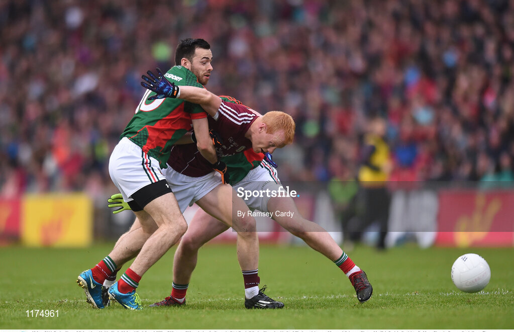 18 June 2016; Declan Kyne of Galway is tackled by Kevin McLoughlin, left, and Cillian O’Connor of Mayo during the Connacht GAA Football Senior Championship Semi-Final match between Mayo and Galway at Elverys MacHale Park in Castlebar, Co Mayo. Photo by Ramsey Cardy/Sportsfile