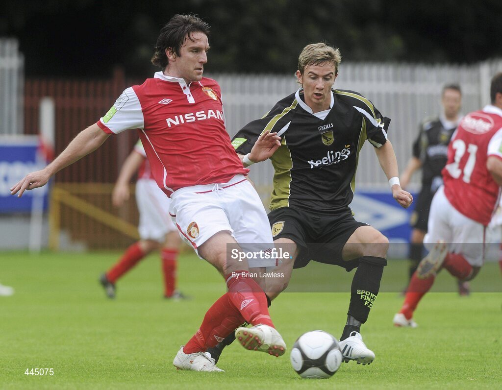 25 July 2010; Stuart Byrne, St Patrick's Athletic, in action against Ronan Finn, Sporting Fingal. Airtricity League Premier Division, St Patrick's Athletic v Sporting Fingal, Richmond Park, Dublin. Picture credit: Brian Lawless / SPORTSFILE