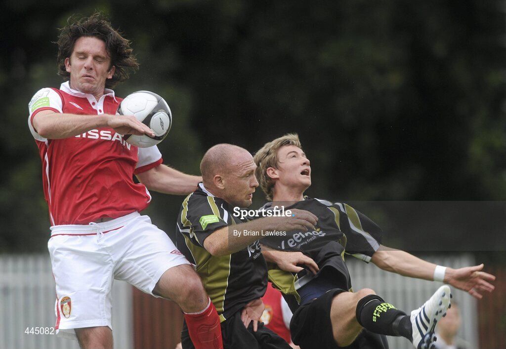 25 July 2010; Stuart Byrne, St Patrick's Athletic, in action against Glen Crowe and Ronan Finn, right, Sporting Fingal. Airtricity League Premier Division, St Patrick's Athletic v Sporting Fingal, Richmond Park, Dublin. Picture credit: Brian Lawless / SPORTSFILE