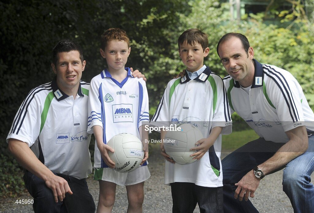 28 July 2010; Kildare's Dermot Earley and Tyrone's Sean Cavanagh with Eanna Goodwin, right, age 8, from Kilcock, Co. Kildare, and Gavin Henderson, age 8, from Bray, Co. Wicklow, at the launch of the MBNA Kick Fada 2010. The 11th annual MBNA Kick Fada will take place at Bray Emmets GAA Club on Saturday 11th September and will feature over 20 stars of inter county Gaelic football. Bank of America and MBNA, Hatch Street, Dublin and Iveagh Gardens. Picture credit: David Maher / SPORTSFILE