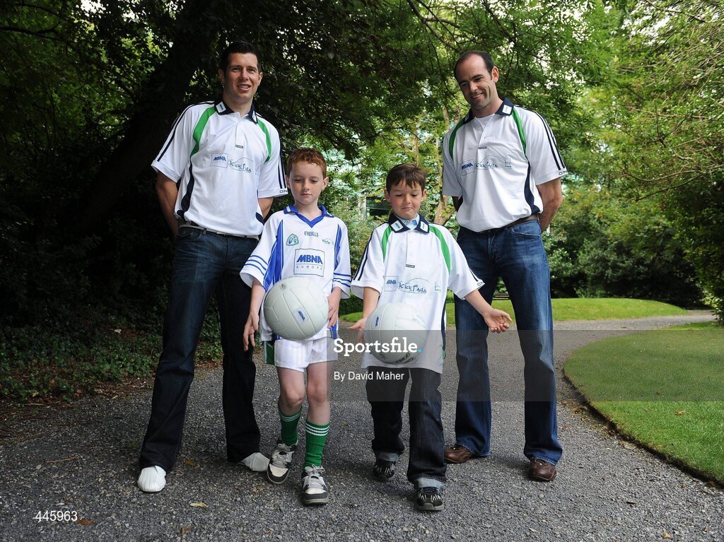 28 July 2010; Dermot Earley, Kildare, and Sean Cavanagh, Tyrone with Eanna Goodwin, second from right, age 8 from Kilcock, Co. Kildare, and Gavin Henderson, age 8, from Bray, Co. Wicklow, at the launch of the MBNA Kick Fada 2010. The 11th annual MBNA Kick Fada will take place at Bray Emmets GAA Club on Saturday 11th September and will feature over 20 stars of inter county Gaelic football. Bank of America and MBNA, Hatch Street, Dublin and Iveagh Gardens. Picture credit: David Maher / SPORTSFILE