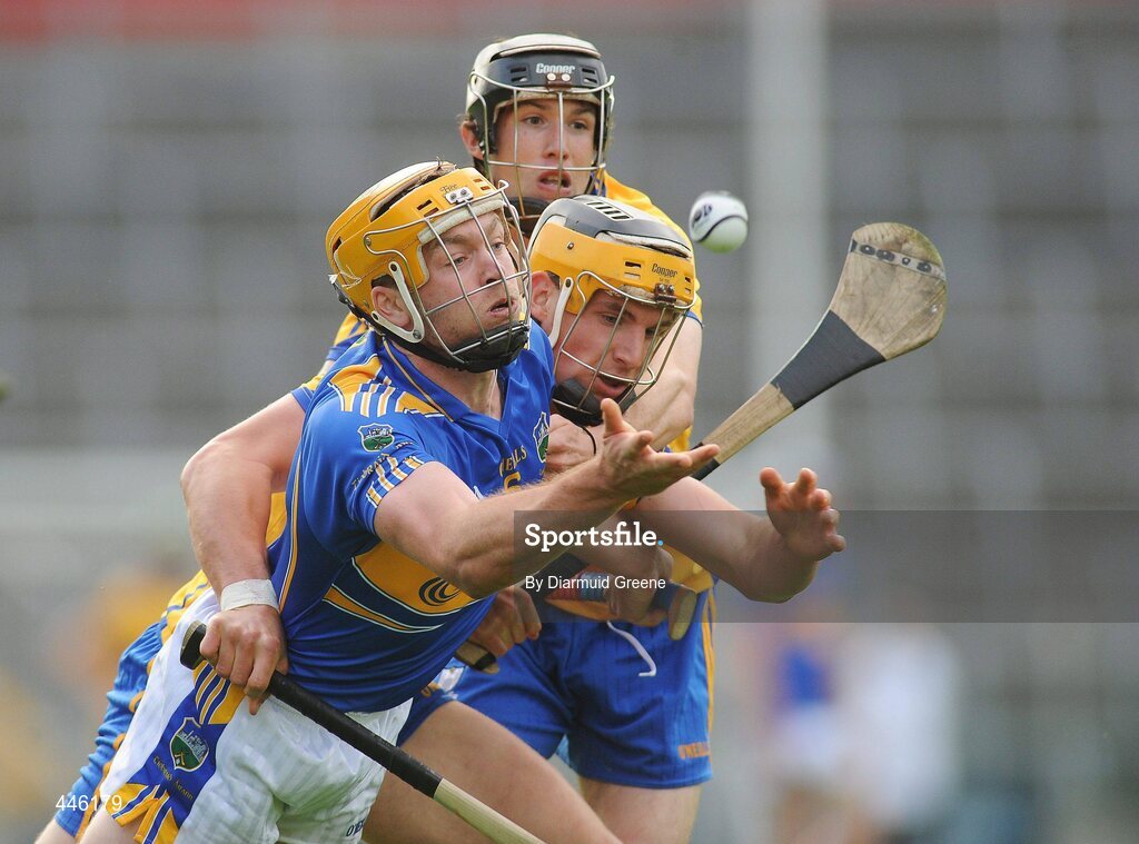 28 July 2010; Padraic Maher, Tipperary, in action against John Conlon and Fergus Kennedy, Clare. Bord Gáis Energy GAA Hurling Under 21 Munster Championship Final, Tipperary v Clare, Semple Stadium, Thurles, Co. Tipperary. Picture credit: Diarmuid Greene / SPORTSFILE
