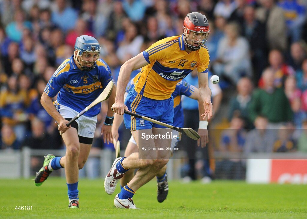 28 July 2010; Darach Honan, Clare, in action against James Barry, Tipperary. Bord Gáis Energy GAA Hurling Under 21 Munster Championship Final, Tipperary v Clare, Semple Stadium, Thurles, Co. Tipperary. Picture credit: Diarmuid Greene / SPORTSFILE
