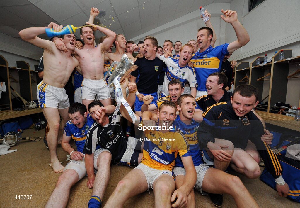 28 July 2010; The Tipperary team celebrate with the cup in their dressing room after victory over Clare. Bord Gáis Energy GAA Hurling Under 21 Munster Championship Final, Tipperary v Clare, Semple Stadium, Thurles, Co. Tipperary. Picture credit: Diarmuid Greene / SPORTSFILE