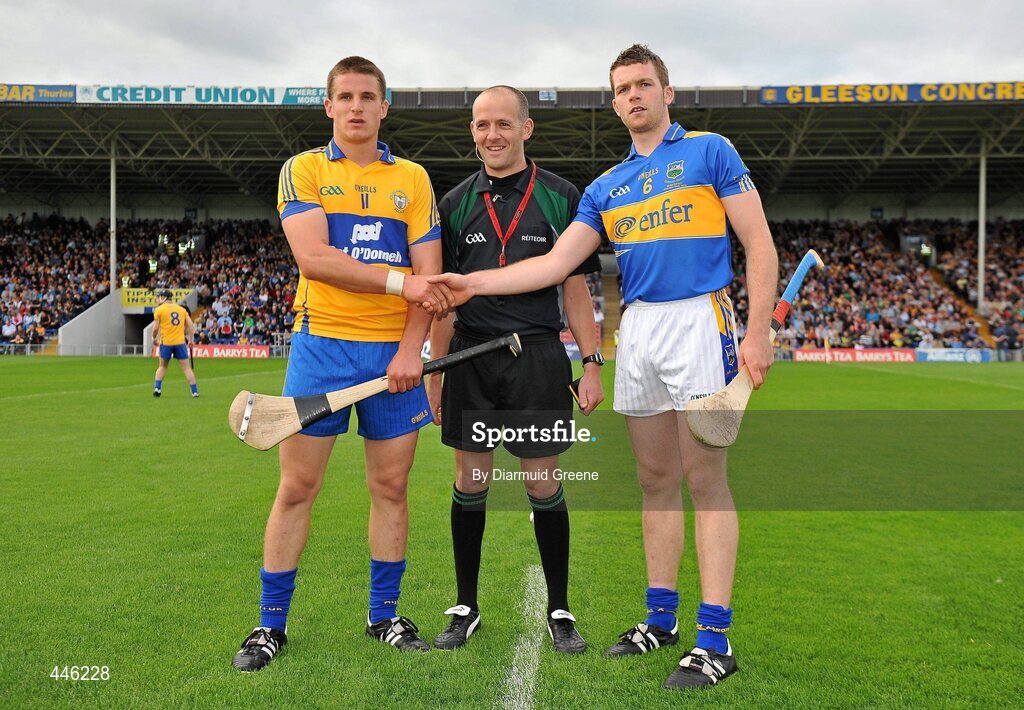 28 July 2010; Clare captain John Conlon, left, and Tipperary captain Padraic Maher with referee Cathal McAllister before the game. Bord Gáis Energy GAA Hurling Under 21 Munster Championship Final, Tipperary v Clare, Semple Stadium, Thurles, Co. Tipperary. Picture credit: Diarmuid Greene / SPORTSFILE