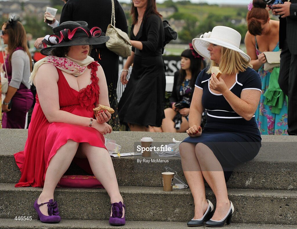 29 July 2010; Two patrons of Ladies Day enjoy a spot of lunch before racing. Galway Racing Festival 2010, Ballybrit, Galway. Picture credit: Ray McManus / SPORTSFILE