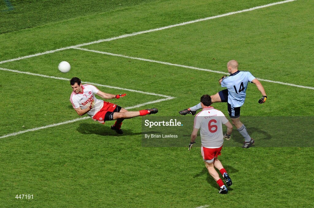 31 July 2010; Eoghan O'Gara, Dublin, shoots past Tyrone's Justin McMahon to score his side's first goal. GAA Football All-Ireland Senior Championship Quarter-Final, Tyrone v Dublin, Croke Park, Dublin. Picture credit: Brian Lawless / SPORTSFILE