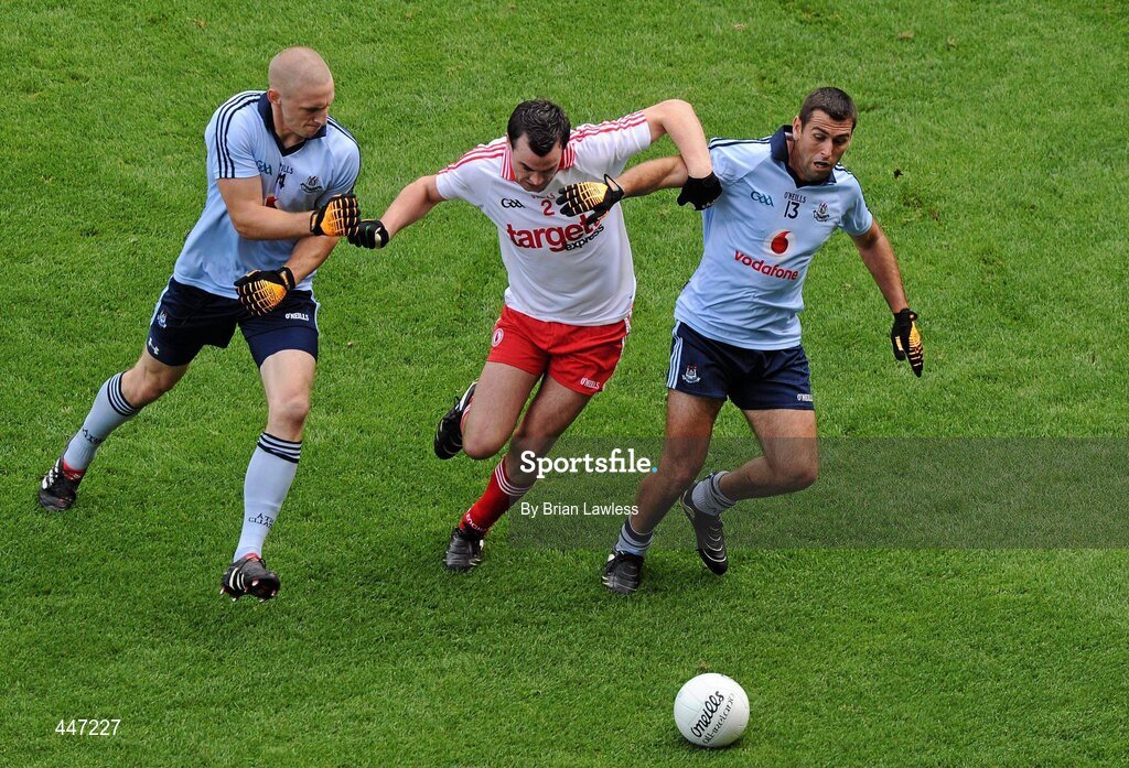 31 July 2010; Cathal McCarron, Tyrone, in action against Eoghan O'Gara, left, and David Henry, Dublin. GAA Football All-Ireland Senior Championship Quarter-Final, Tyrone v Dublin, Croke Park, Dublin. Picture credit: Brian Lawless / SPORTSFILE