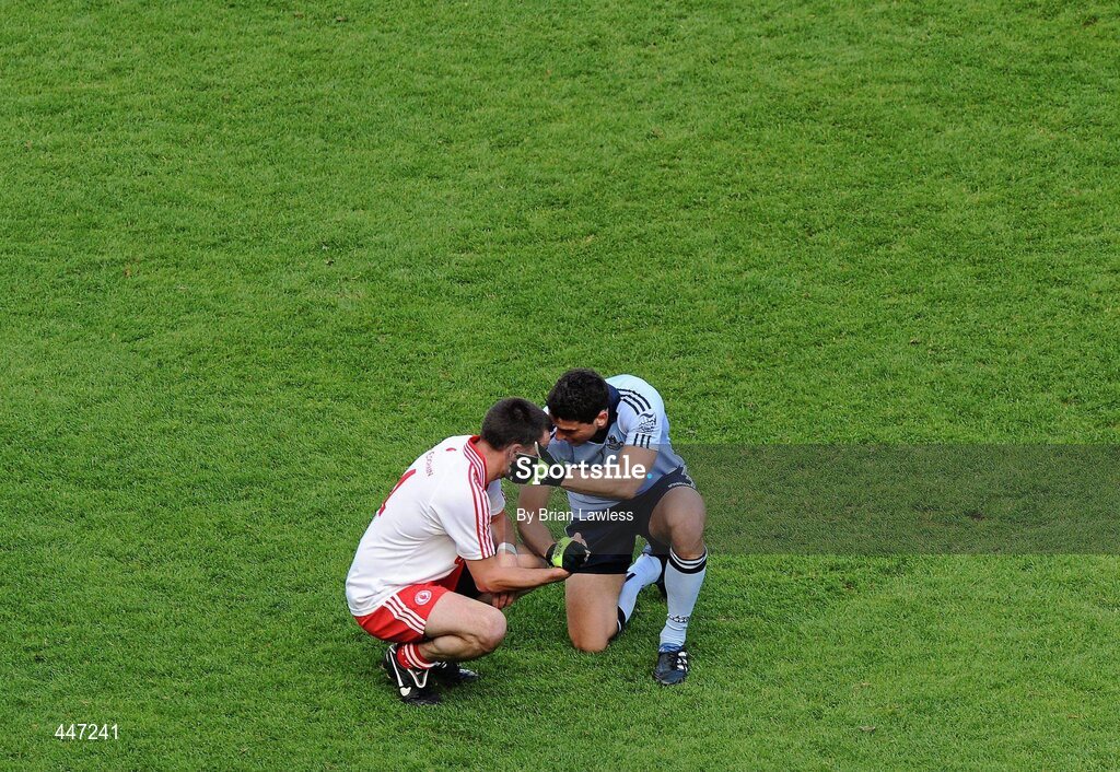 31 July 2010; Dublin's Bernard Brogan consoles Tyrone's Ryan McMenamin after the match. GAA Football All-Ireland Senior Championship Quarter-Final, Tyrone v Dublin, Croke Park, Dublin. Picture credit: Brian Lawless / SPORTSFILE