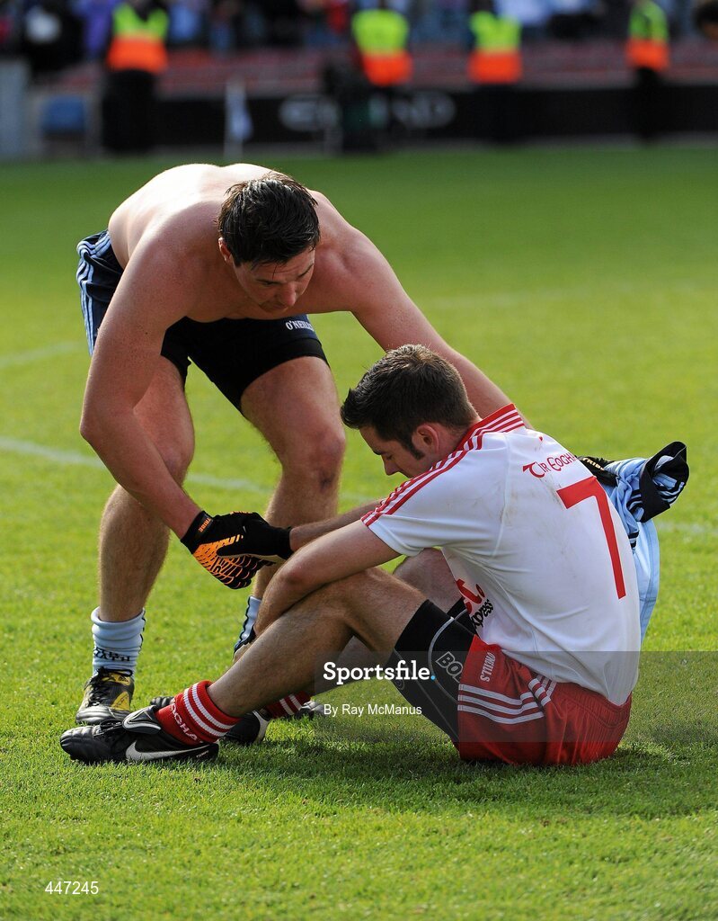 31 July 2010; Dublin's Éamon Fennell consoles Tyrone's Philip Jordan after the game. GAA Football All-Ireland Senior Championship Quarter-Final, Tyrone v Dublin, Croke Park, Dublin. Picture credit: Ray McManus / SPORTSFILE