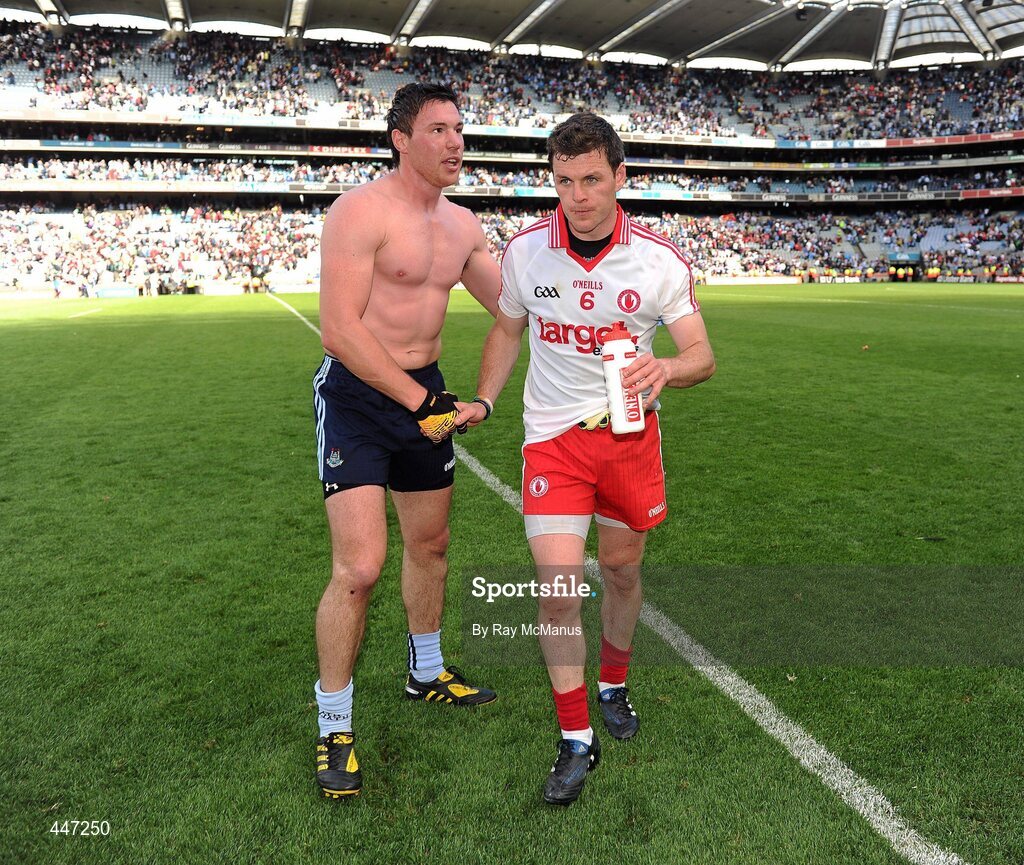 31 July 2010; Éamon Fennell, Dublin, with Tyrone's Conor Gormley after the game. GAA Football All-Ireland Senior Championship Quarter-Final, Tyrone v Dublin, Croke Park, Dublin. Picture credit: Ray McManus / SPORTSFILE