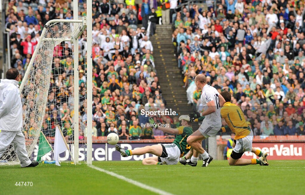 1 August 2010; James Kavanagh, Kildare, puts the ball past Meath goalkeeper Brendan Murphy and Kevin Reilly to score his side's first goal. GAA Football All-Ireland Senior Championship Quarter-Final, Meath v Kildare, Croke Park, Dublin. Picture credit: Barry Cregg / SPORTSFILE