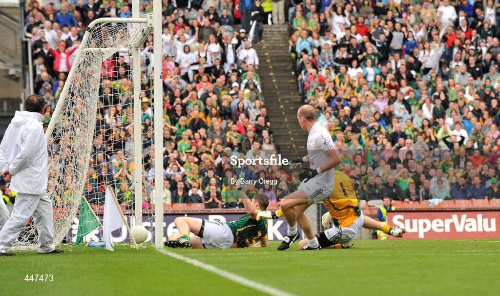 1 August 2010; James Kavanagh, Kildare, puts the ball past Meath goalkeeper Brendan Murphy and Kevin Reilly to score his side's first goal. GAA Football All-Ireland Senior Championship Quarter-Final, Meath v Kildare, Croke Park, Dublin. Picture credit: Barry Cregg / SPORTSFILE
