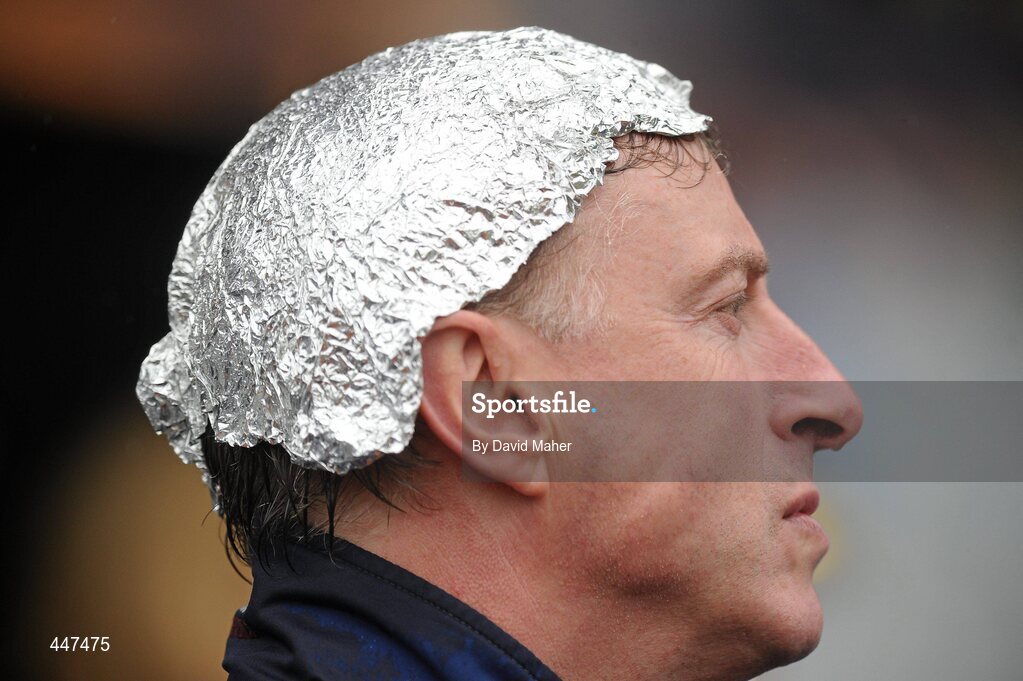 1 August 2010; A supporter using tinfoil to shelter from the heavy rain as he watches on during the game. Supporters at the GAA Football All-Ireland Senior Championship Quarter-Finals, Croke Park, Dublin. Picture credit: David Maher / SPORTSFILE