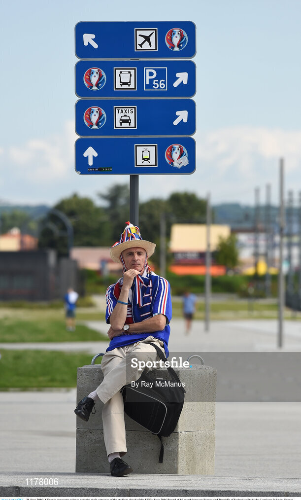 26 June 2016; A France supporter relaxes near the main entrance of the stadium ahead of the UEFA Euro 2016 Round of 16 match between France and Republic of Ireland at Stade des Lumieres in Lyon, France. Photo by Ray McManus/Sportsfile