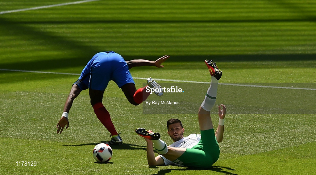 26 June 2016; Shane Long of the Republic of Ireland is fouled by Paul Pogba of Frane resulting in a penalty for Ireland in the UEFA Euro 2016 Round of 16 match between France and Republic of Ireland at Stade des Lumieres in Lyon, France. Photo by Ray McManus/Sportsfile