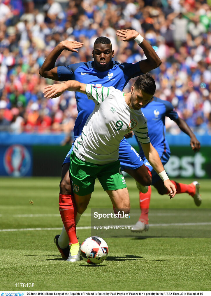 26 June 2016; Shane Long of the Republic of Ireland is fouled by Paul Pogba of France for a penalty in the UEFA Euro 2016 Round of 16 match between France and Republic of Ireland at Stade des Lumieres in Lyon, France. Photo by Stephen McCarthy/Sportsfile