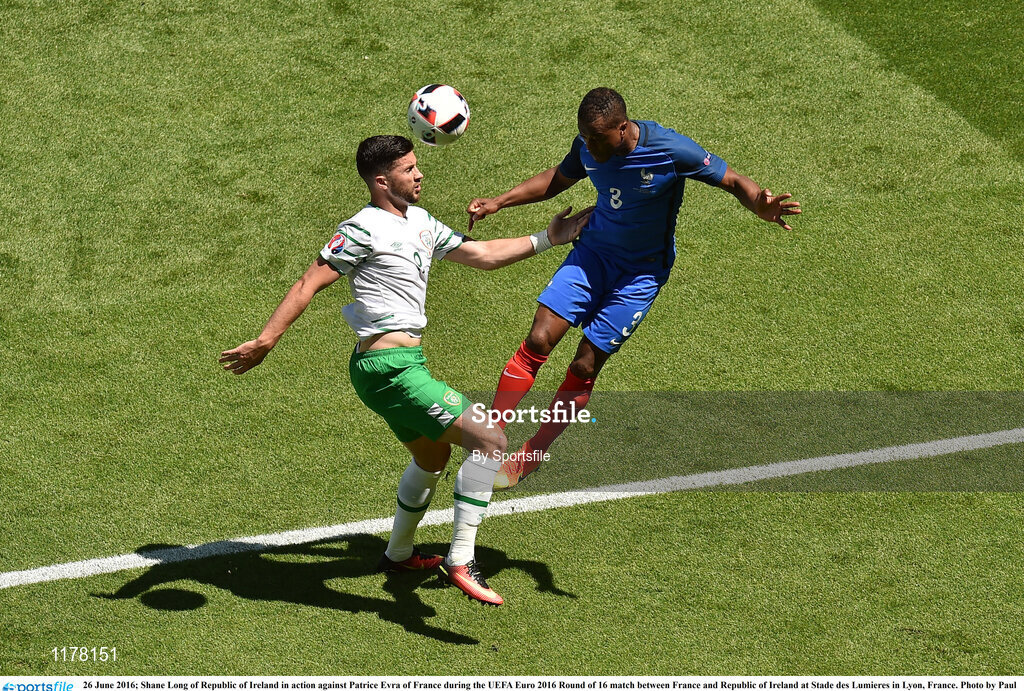 26 June 2016; Shane Long of Republic of Ireland in action against Patrice Evra of France during the UEFA Euro 2016 Round of 16 match between France and Republic of Ireland at Stade des Lumieres in Lyon, France. Photo by Sportsfile