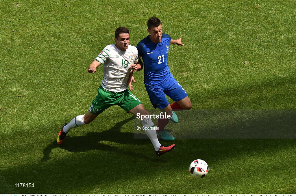 26 June 2016; Robbie Brady of Republic of Ireland in action against Laurent Koscielny of France during the UEFA Euro 2016 Round of 16 match between France and Republic of Ireland at Stade des Lumieres in Lyon, France. Photo by Sportsfile