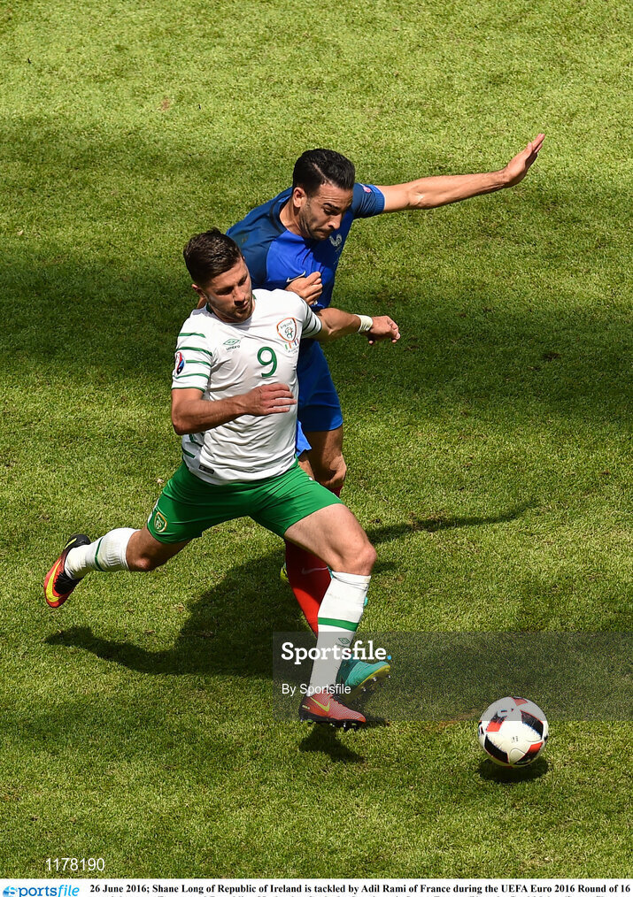 26 June 2016; Shane Long of Republic of Ireland is tackled by Adil Rami of France during the UEFA Euro 2016 Round of 16 match between France and Republic of Ireland at Stade des Lumieres in Lyon, France. Photo by Sportsfile