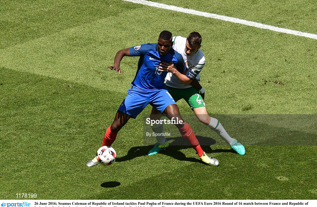 26 June 2016; Seamus Coleman of Republic of Ireland tackles Paul Pogba of France during the UEFA Euro 2016 Round of 16 match between France and Republic of Ireland at Stade des Lumieres in Lyon, France. Photo by Sportsfile
